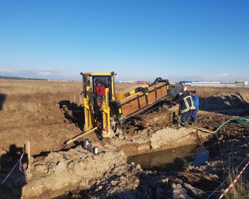 utilaj-hdd-foraj-teava-sub-drum Utilaj HDD realizând foraj orizontal dirijat fără săpătură sub drum